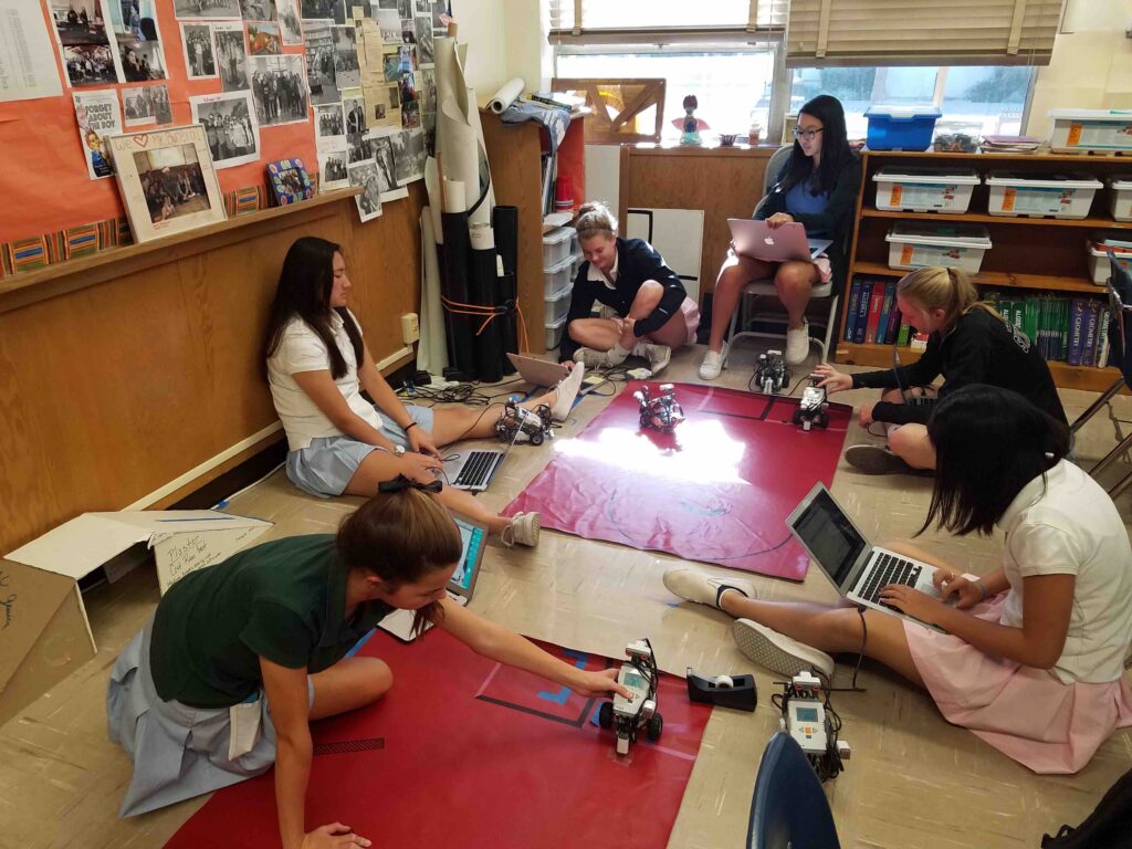 Students training robots to complete a labyrinth, fall 2016